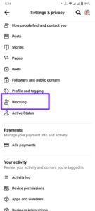 In the Settings menu, scroll down until you see "Blocking." Tap on it to access your blocked users list.